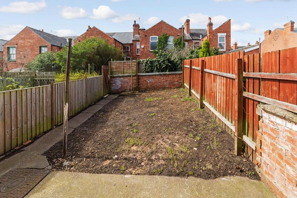 Private rear garden with paved patio and fenced...