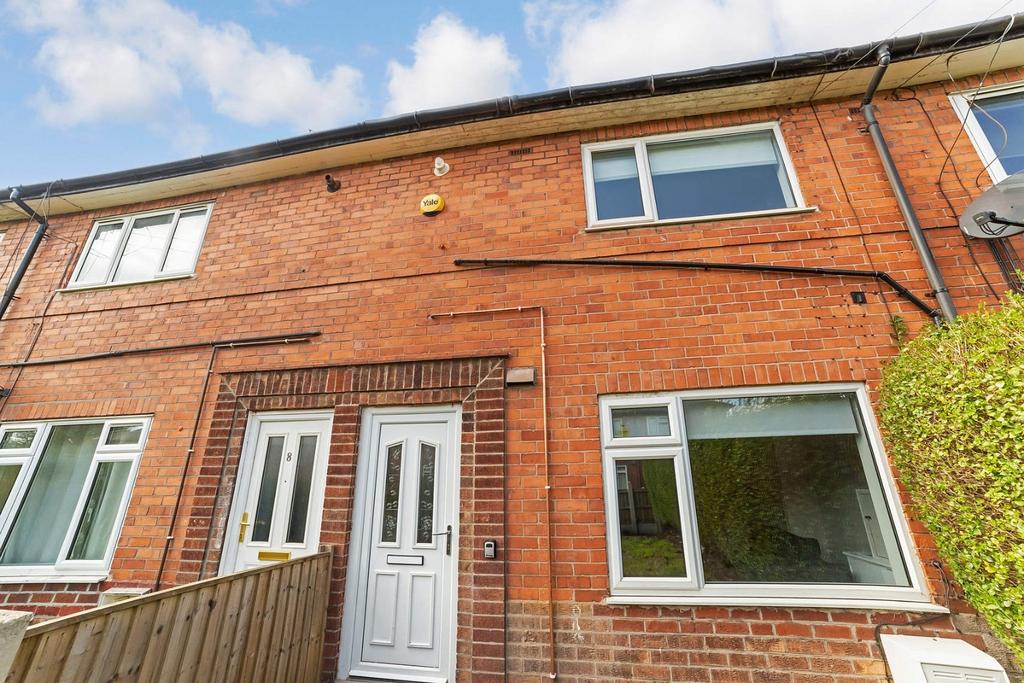 Red-brick terraced house with bright frontage...