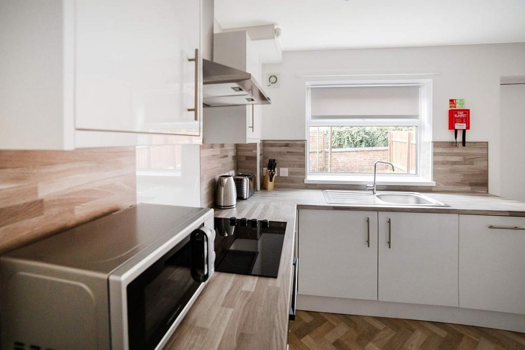 Bright modern kitchen with clean worktops...