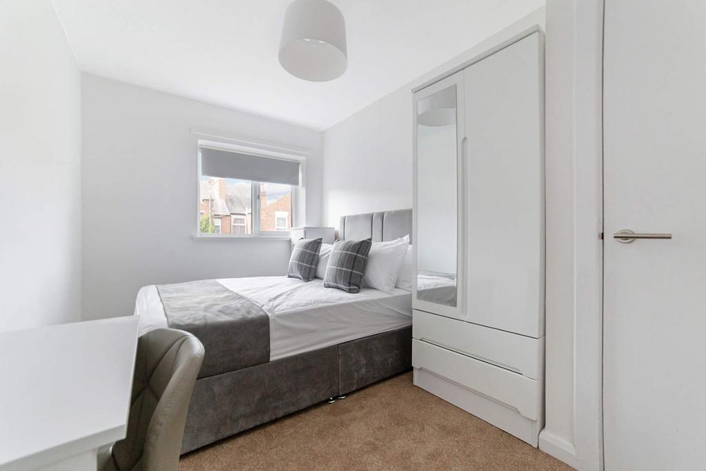 Bright, modern bedroom with built-in storage...