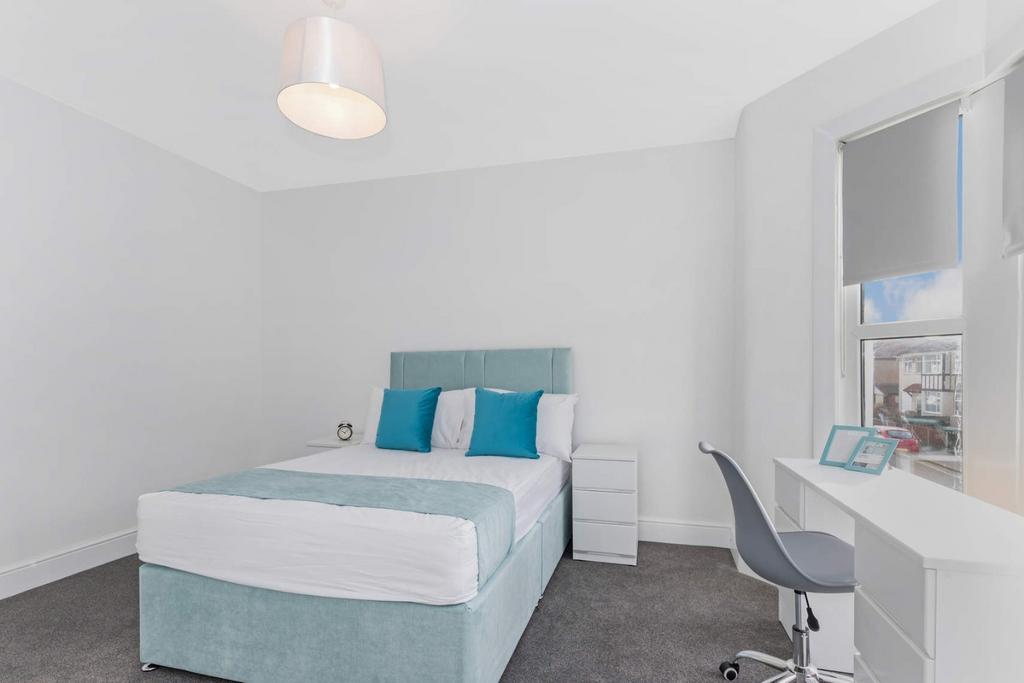 Bright, modern bedroom with study area...