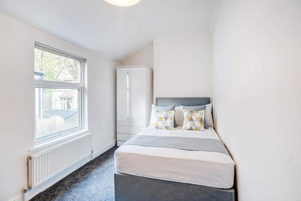 Bright bedroom with comfy bed and wardrobe...
