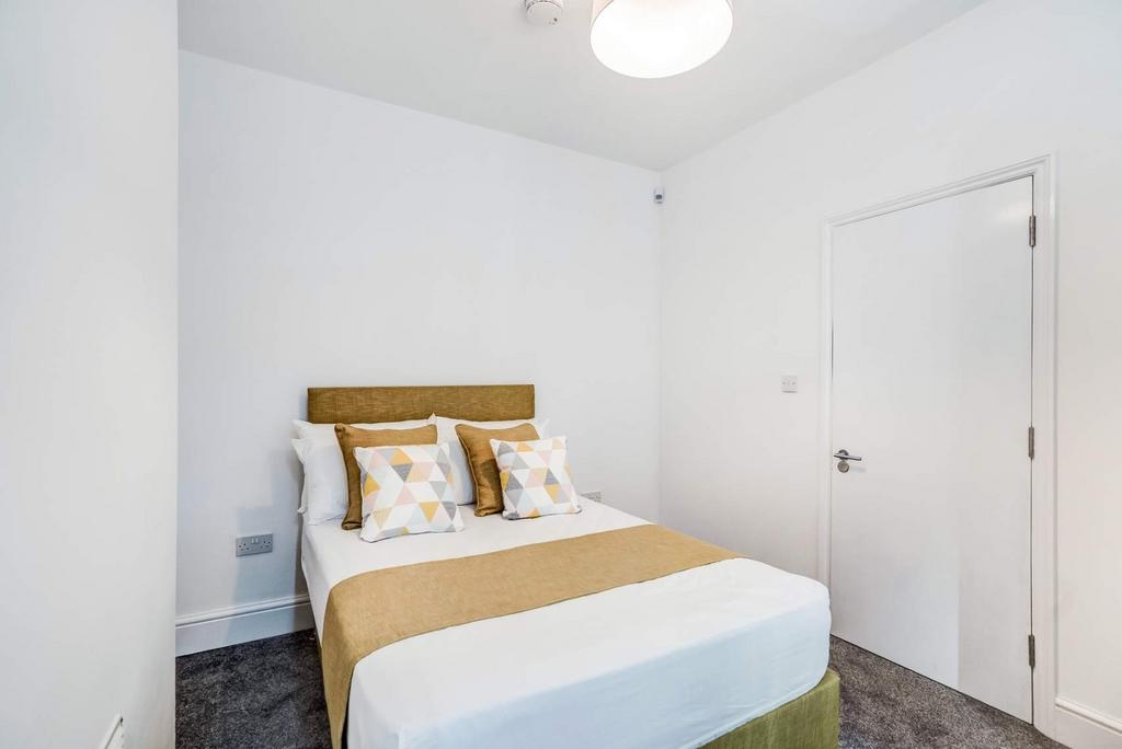 Bright, neat bedroom with stylish soft tones...