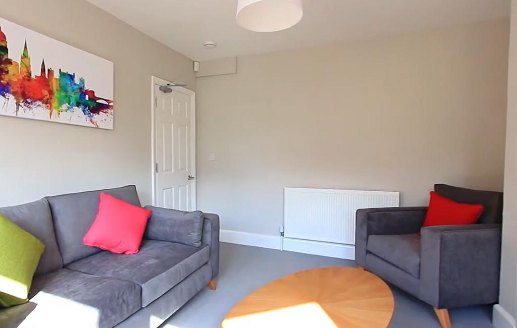 Bright lounge with comfy sofas and colorful art...