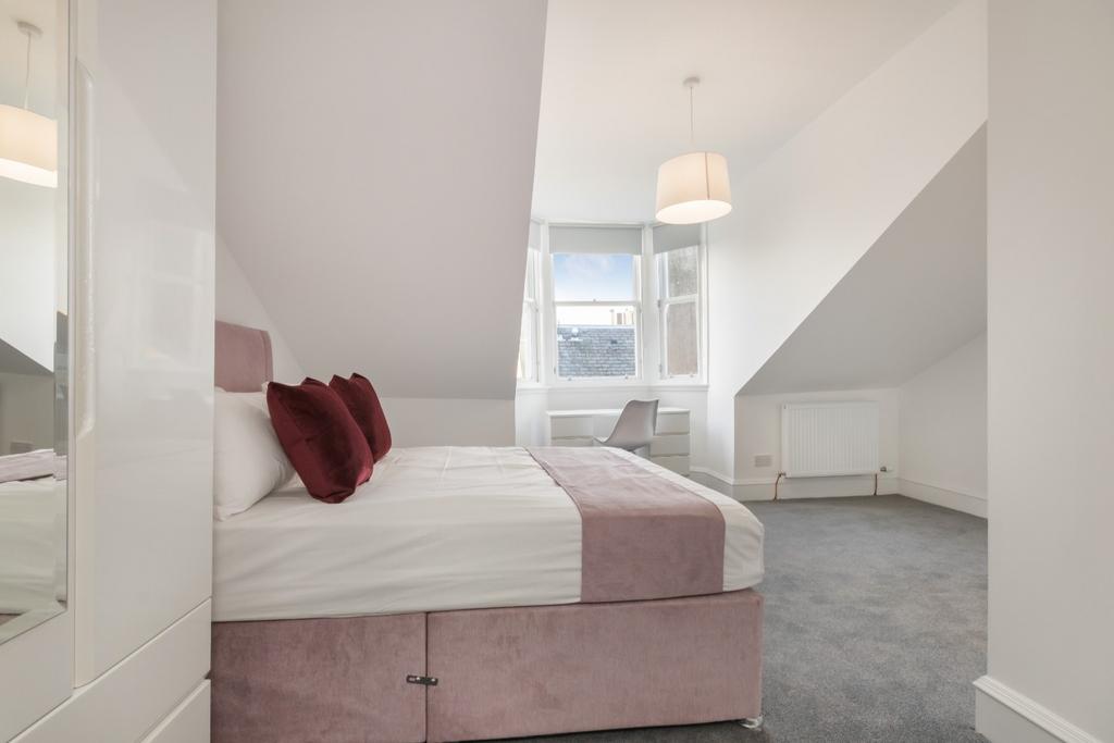 Bright attic double with neat decor and desk...