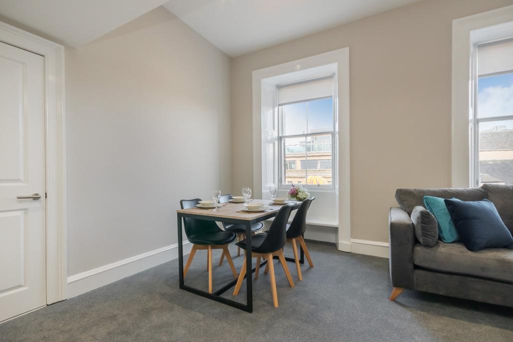 Bright, modern lounge with dining area...