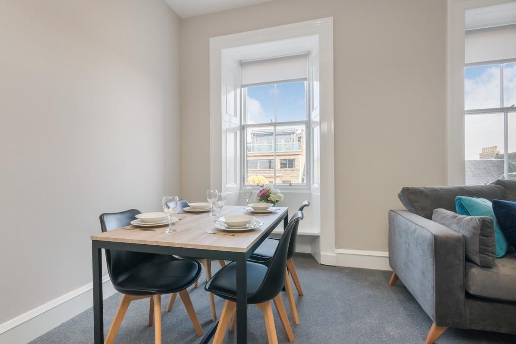 Bright lounge with dining table and sofa...