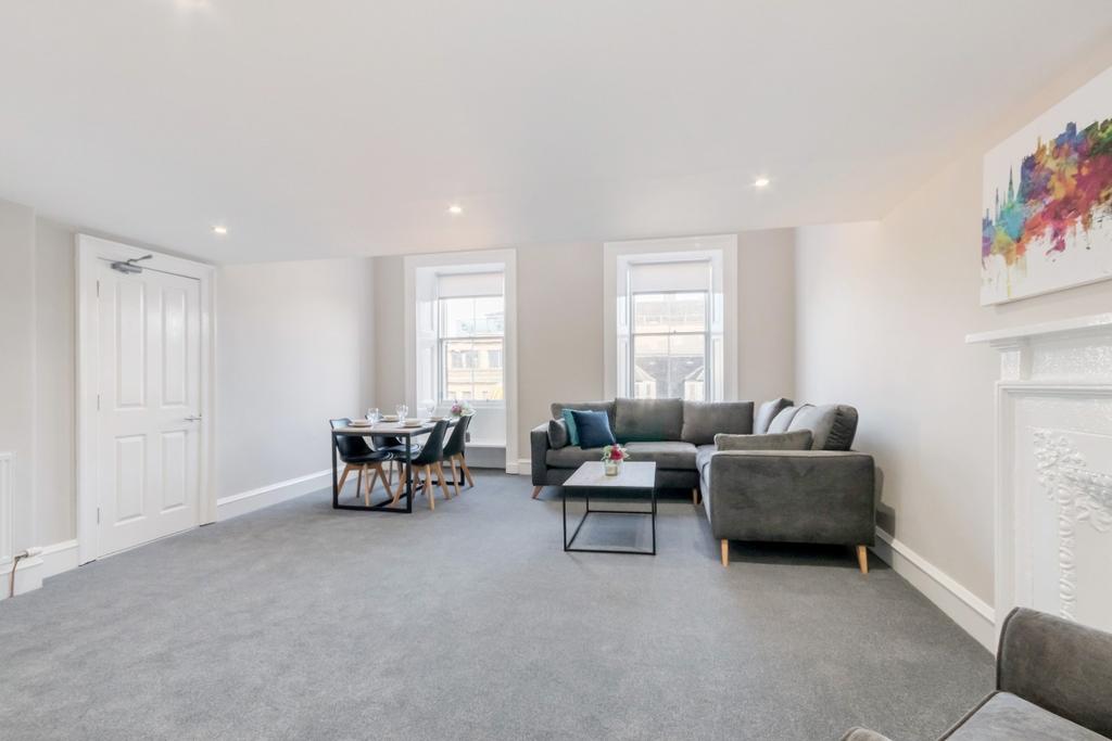 Bright, modern living space with seating area...