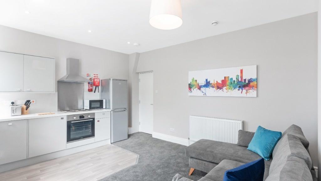 Bright open-plan lounge with modern kitchen...