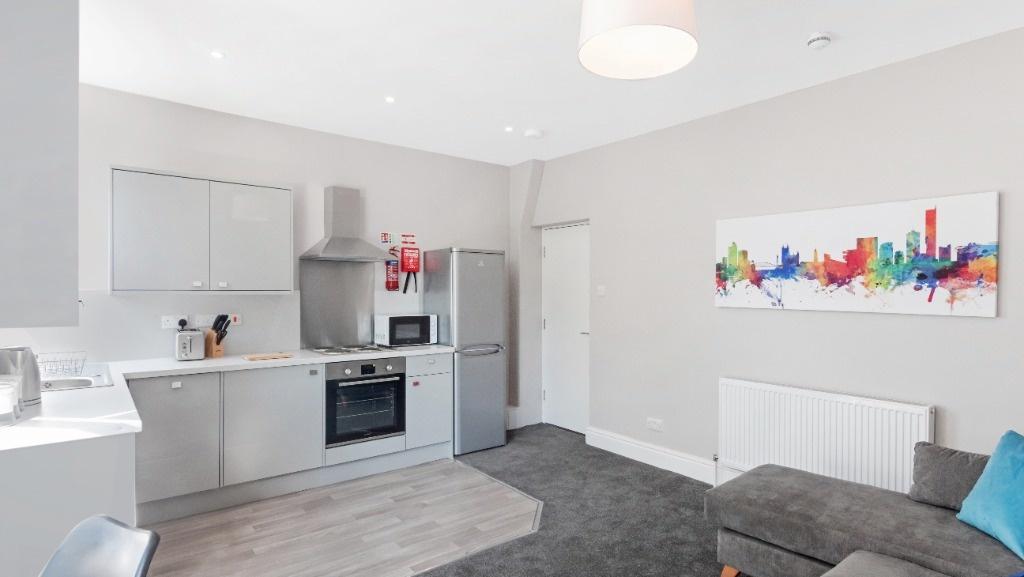 Modern open-plan lounge with fitted kitchen...