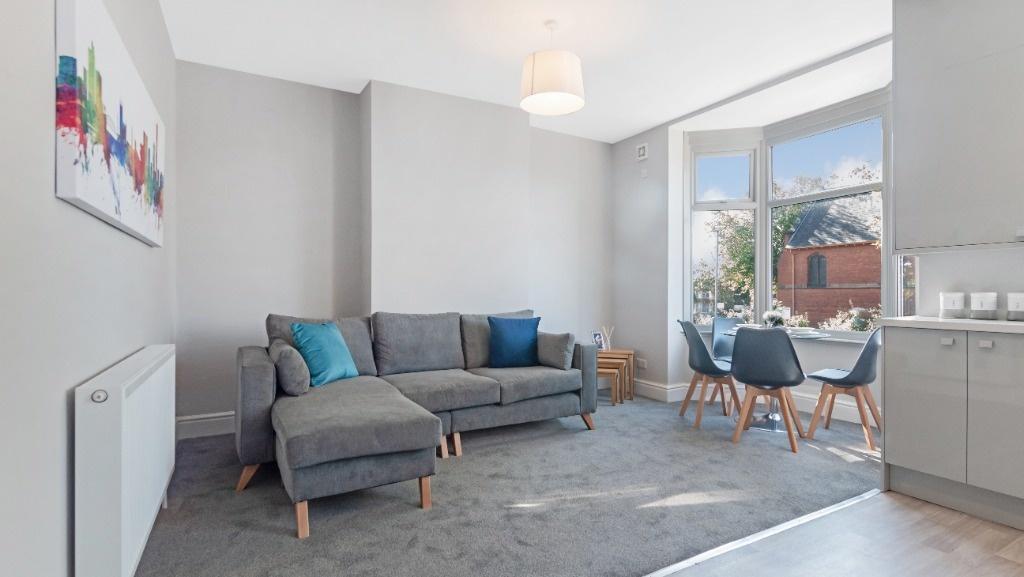 Bright modern open-plan lounge with dining area...