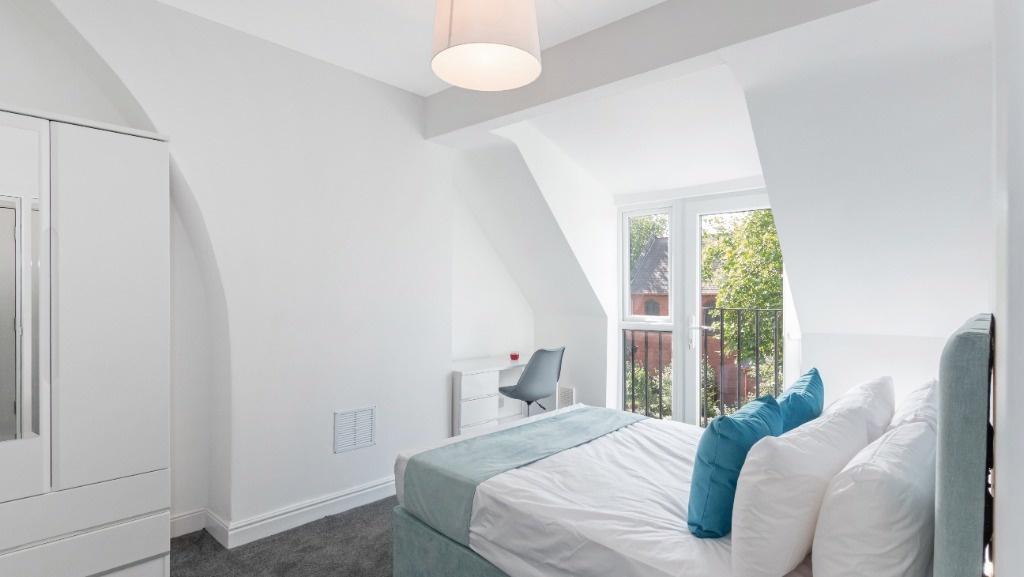 Bright room with double bed and wardrobe...