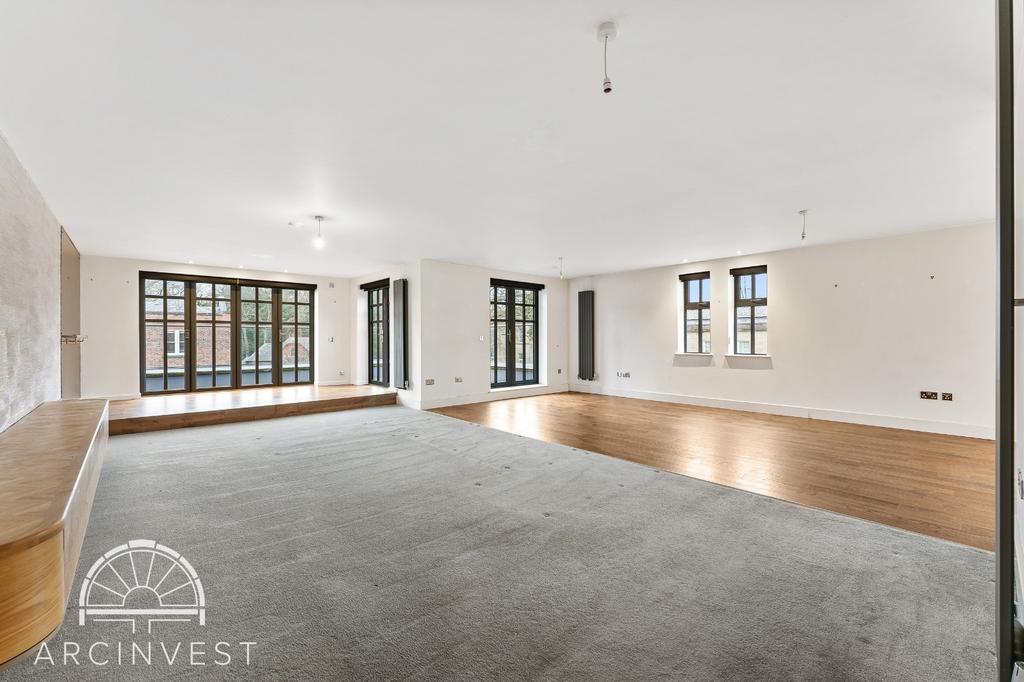 Spacious bright living area with bay windows...