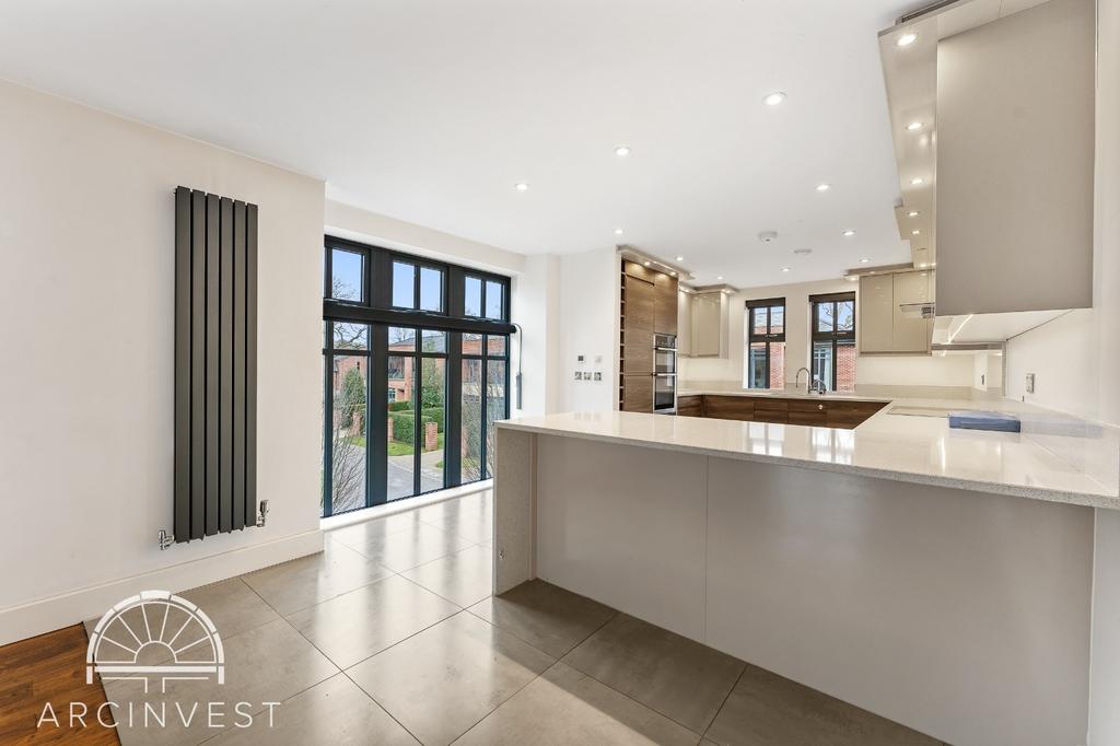 Bright open-plan living area with large windows...