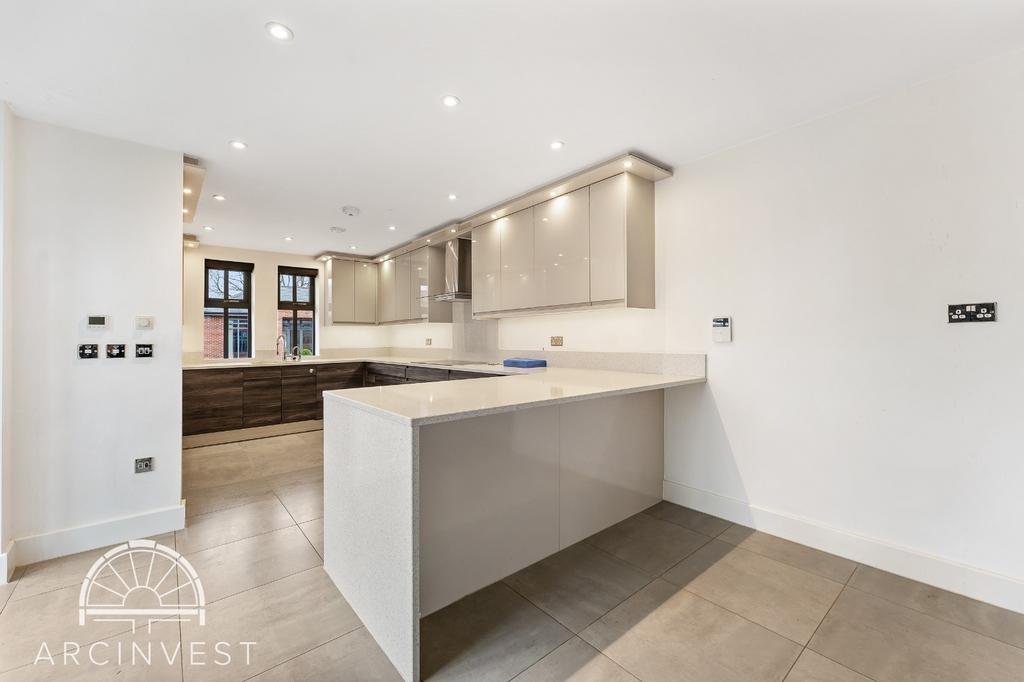 Bright modern kitchen with breakfast bar...