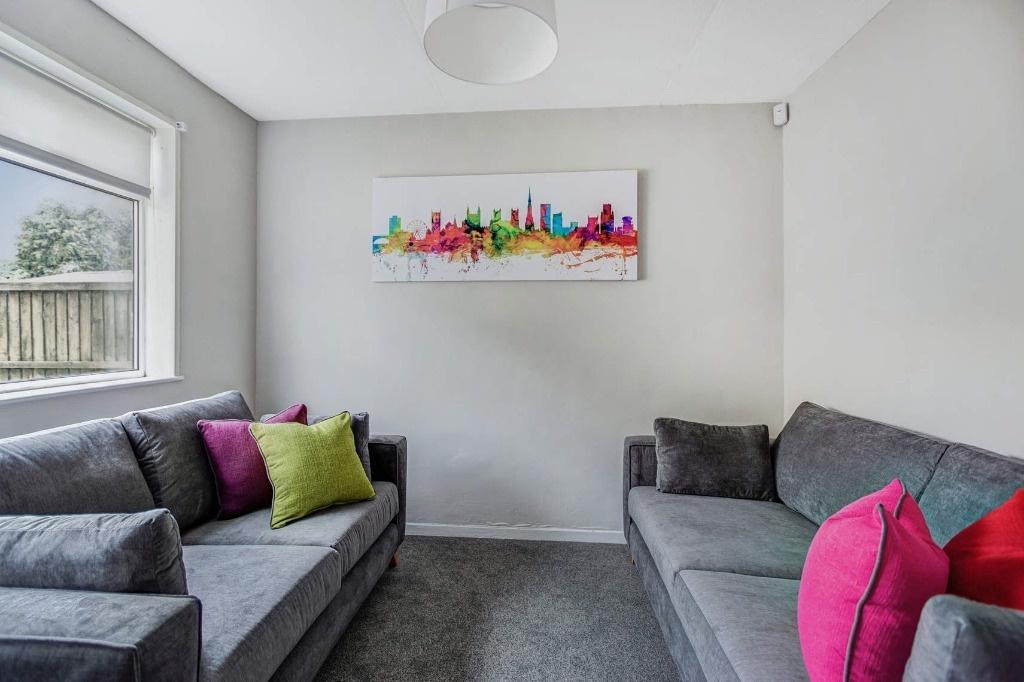 Bright, cosy living room with colourful accents...