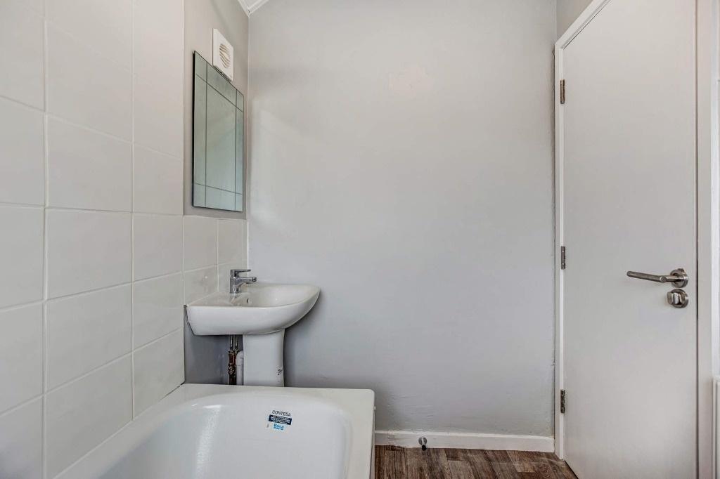 Clean modern bathroom with bath and basin...