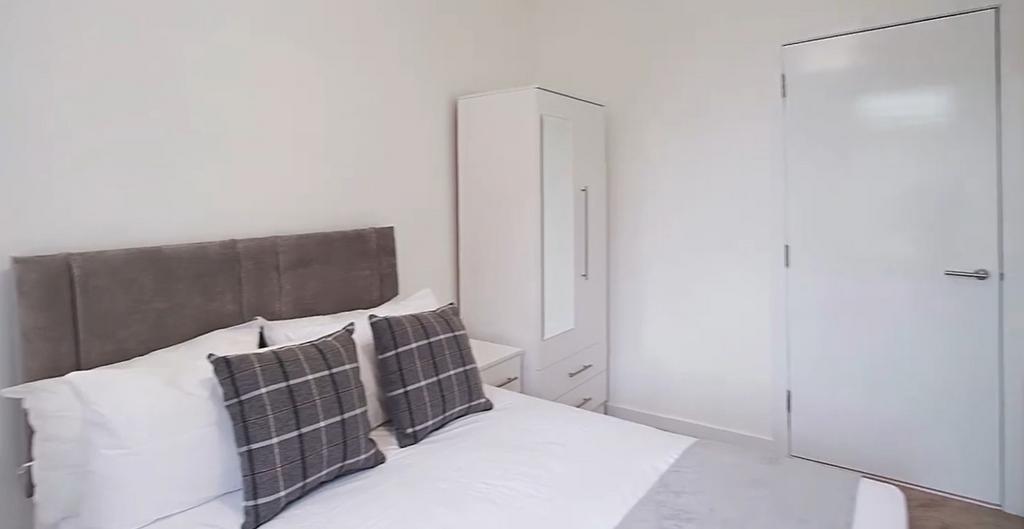 Bright double bedroom with neutral decor...