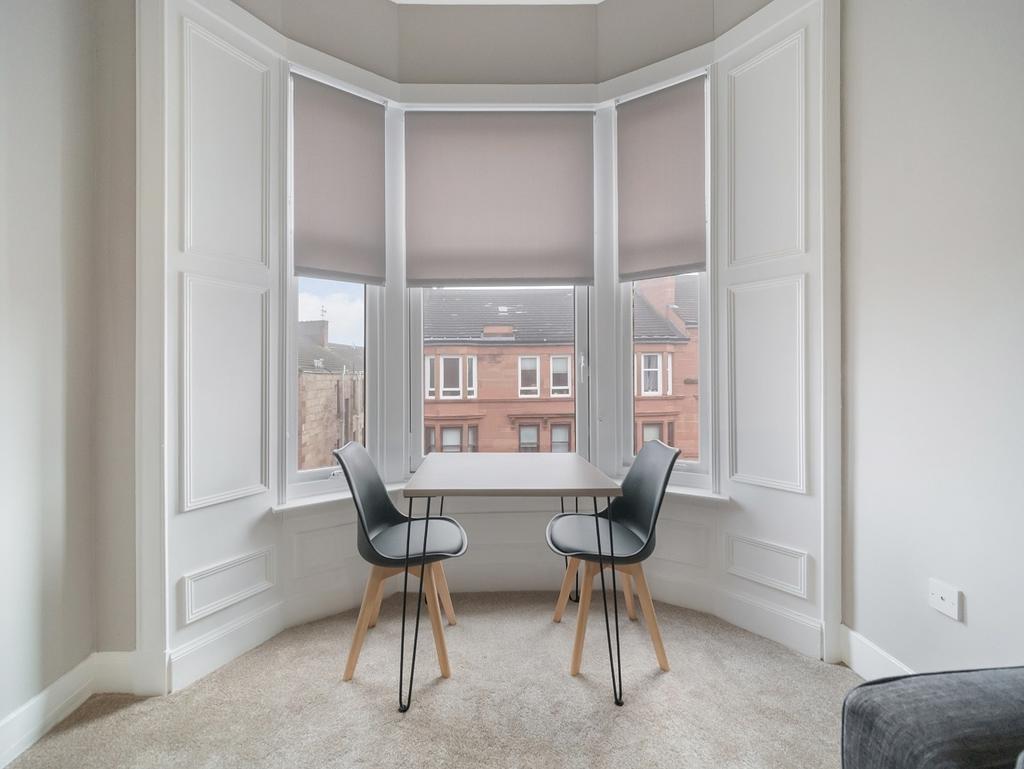 Bright bay-window seating with street views...