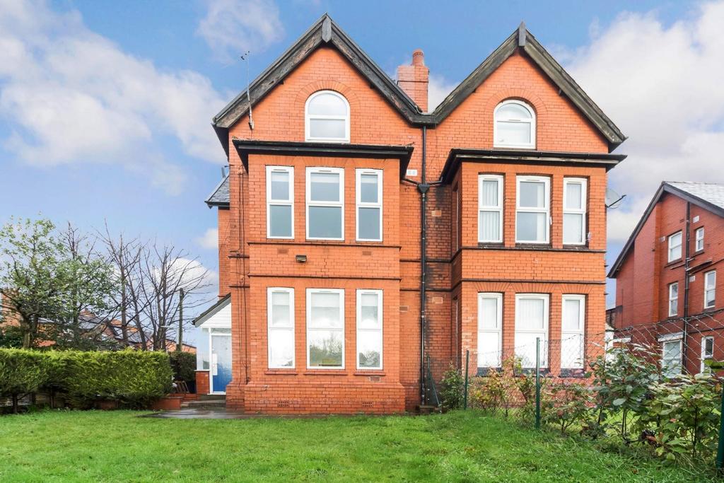 Attractive red‑brick house with front lawn and ...