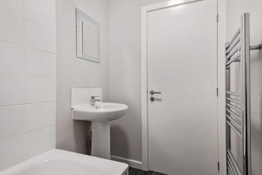 Clean modern bathroom with white fittings...