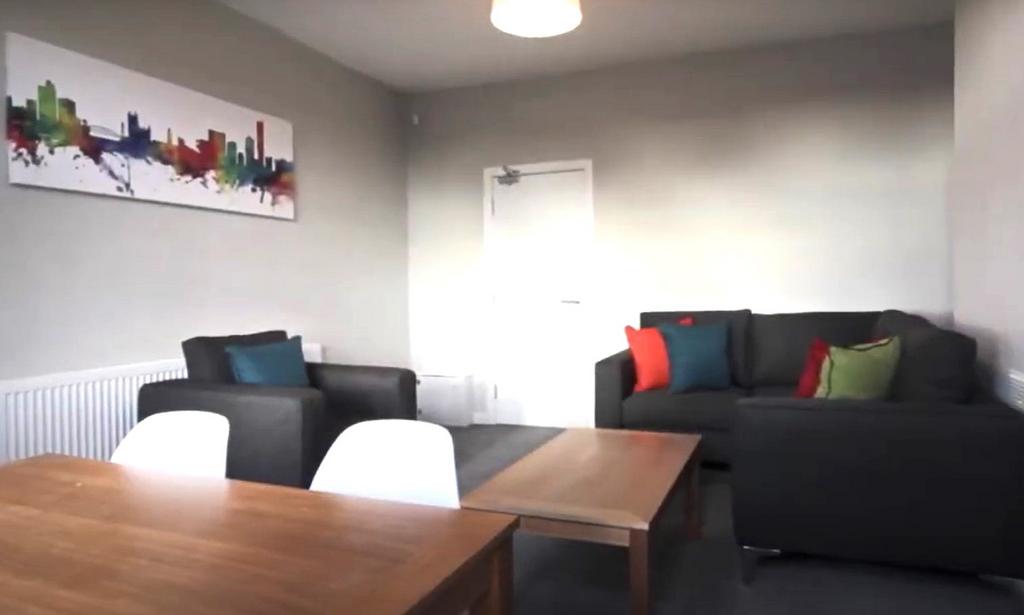 Modern furnished living room with dining area...