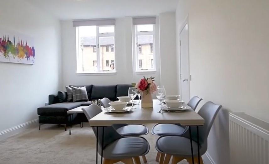 Bright modern living/dining area with sofa and ...