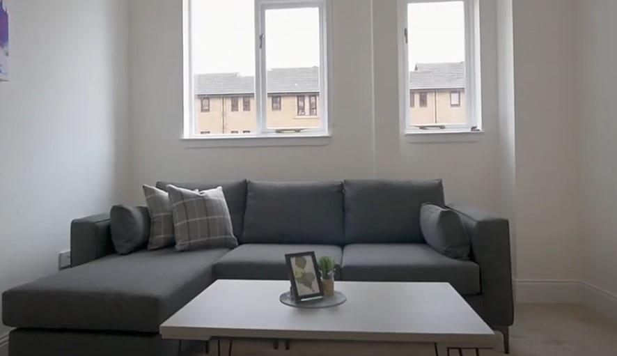 Bright lounge with modern sofa and coffee table...