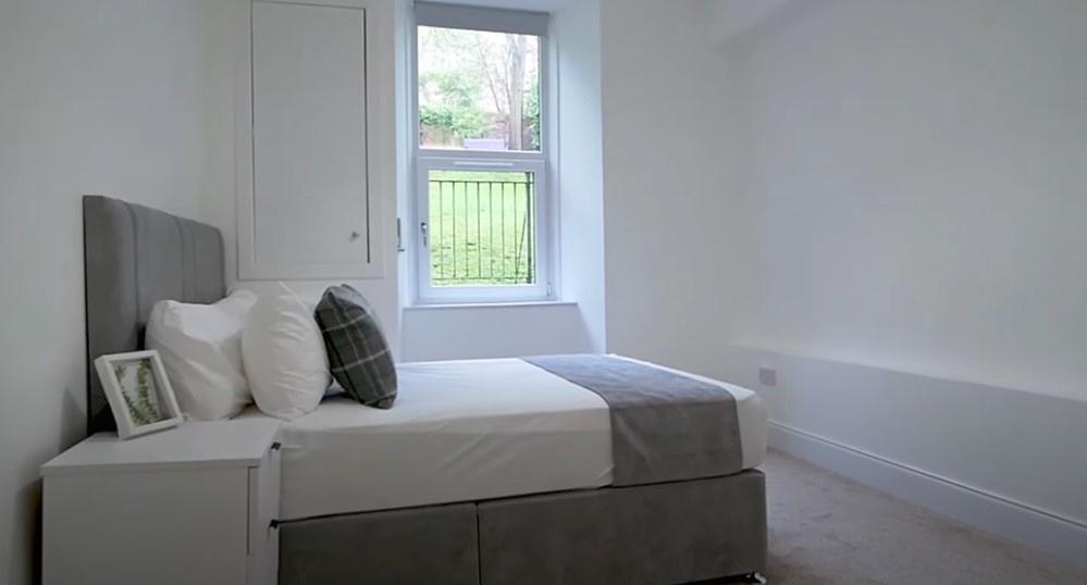 Bright, neatly presented bedroom with comfy dou...