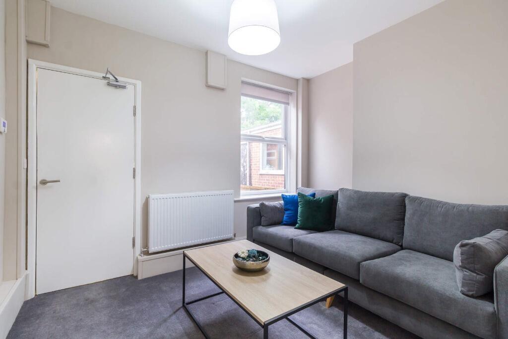 Bright lounge with sofa and coffee table...