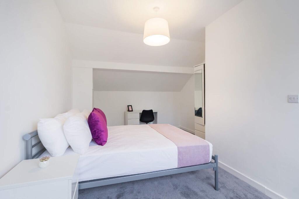 Bright, modern bedroom with décor accents...