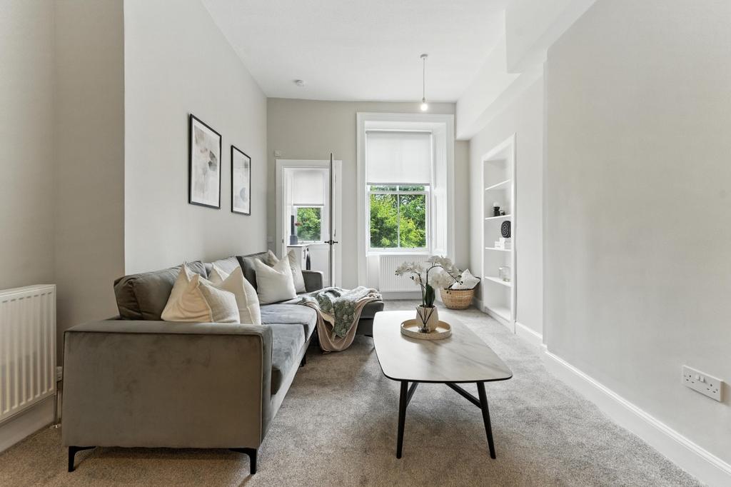 Bright, stylish living room with seating...