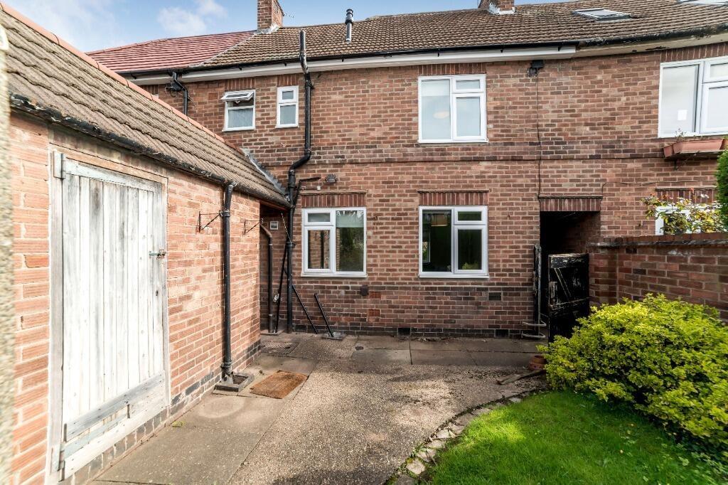 Private paved garden with lawn and garage acces...