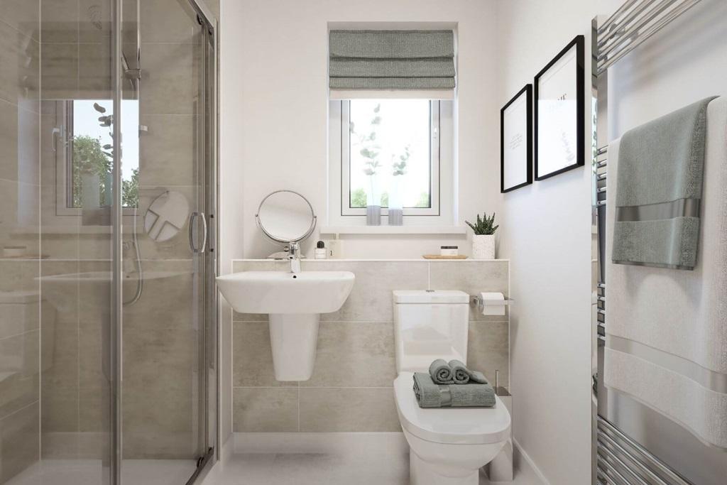 An en suite shower room to bed 1 makes a...