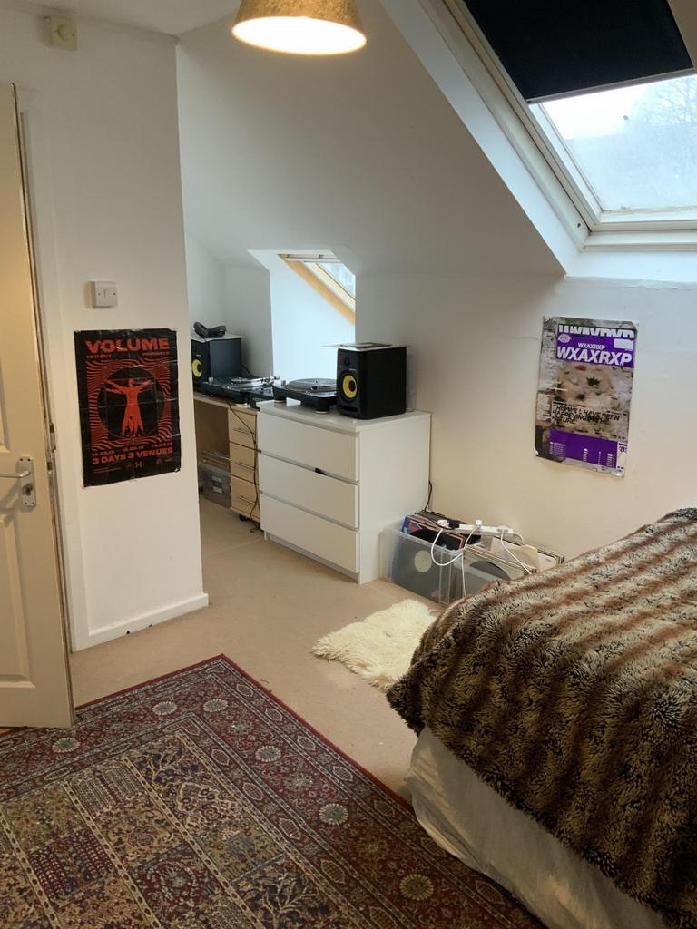 Bright double bedroom in a converted loft with ...