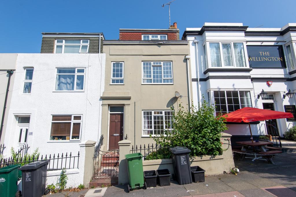 A charming view of the front exterior of a terr...