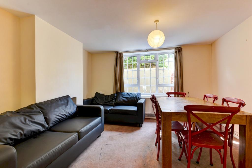 Bright open-plan living and dining area with co...