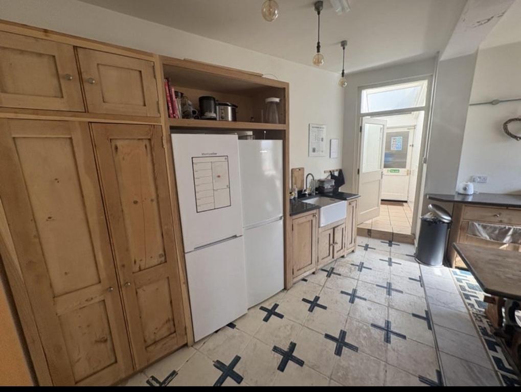 Well-equipped kitchen with storage and natural ...