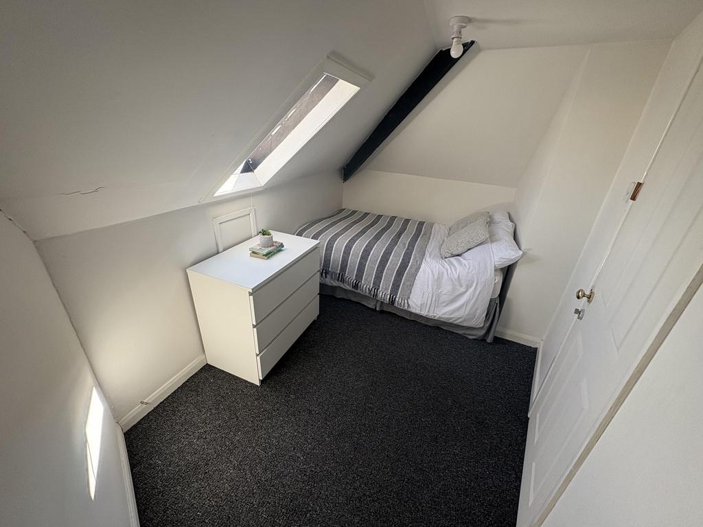 Bright attic single room with bedside storage...