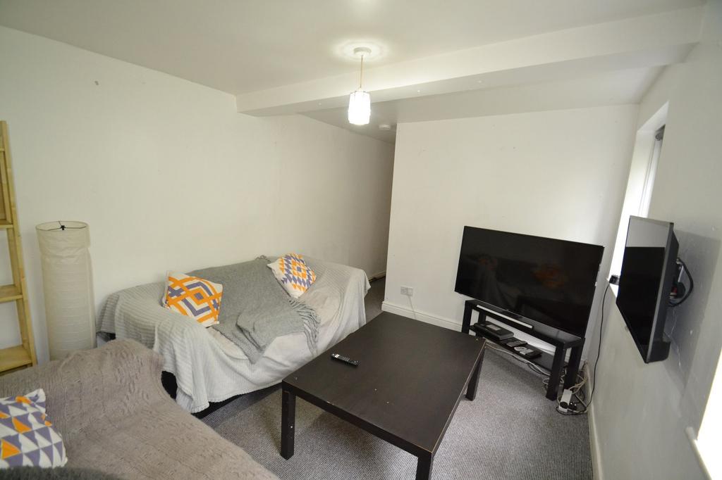 A cozy student living room featuring two sofas ...