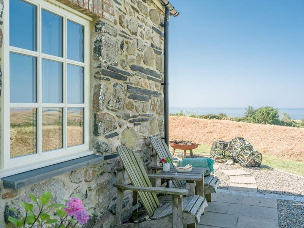Patio overlooking views Pencaer Cottage