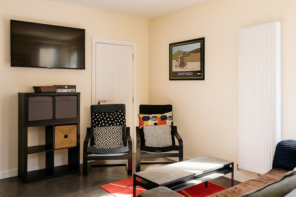 Bright, neatly arranged living room with wall-m...