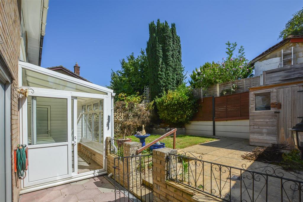 Conservatory interior, french doors leading to garden