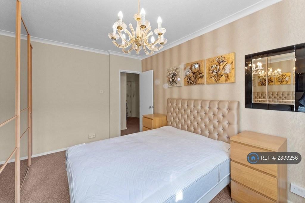 Spacious Bedroom With Ample Wall To Wall Storage
