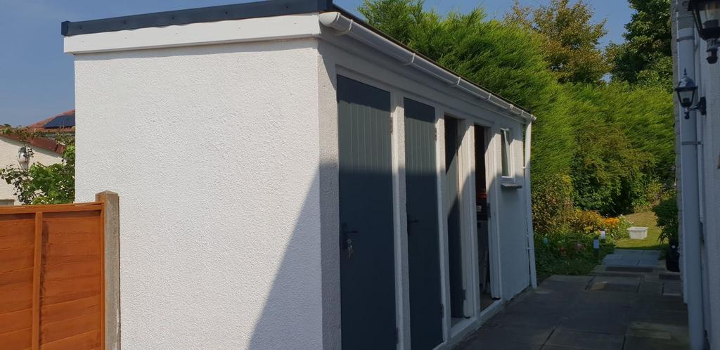 Neat side exterior with freshly painted white r...