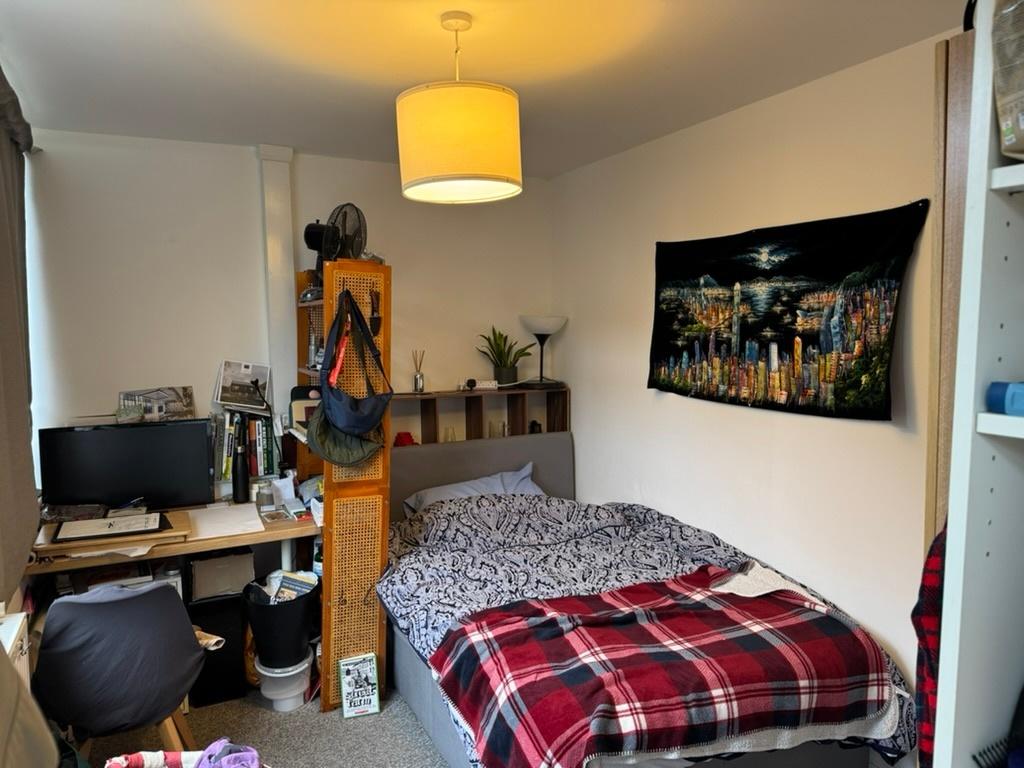 Bright and cozy bedroom with a comfortable doub...