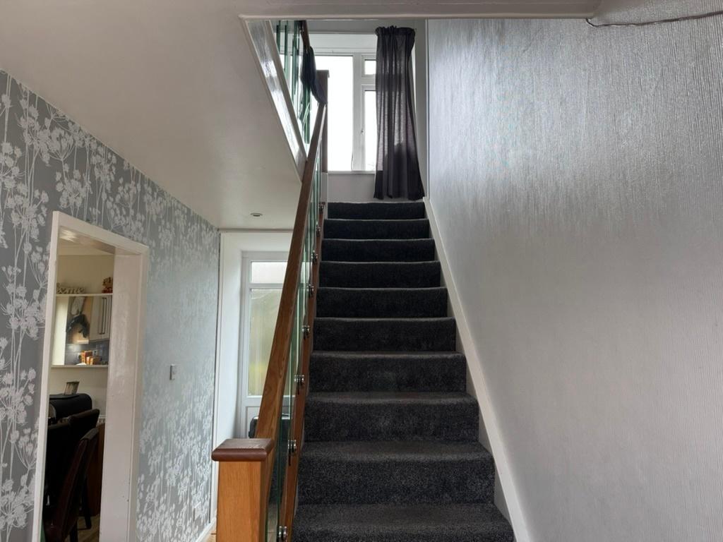 Bright, recently updated staircase with carpete...