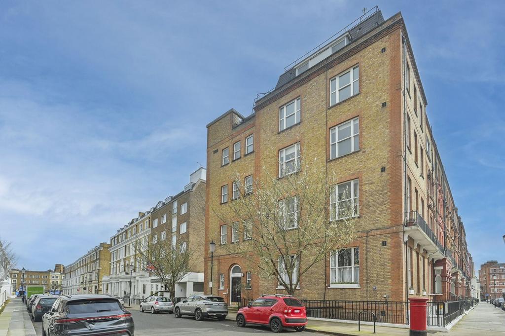 Street scene with property, parking