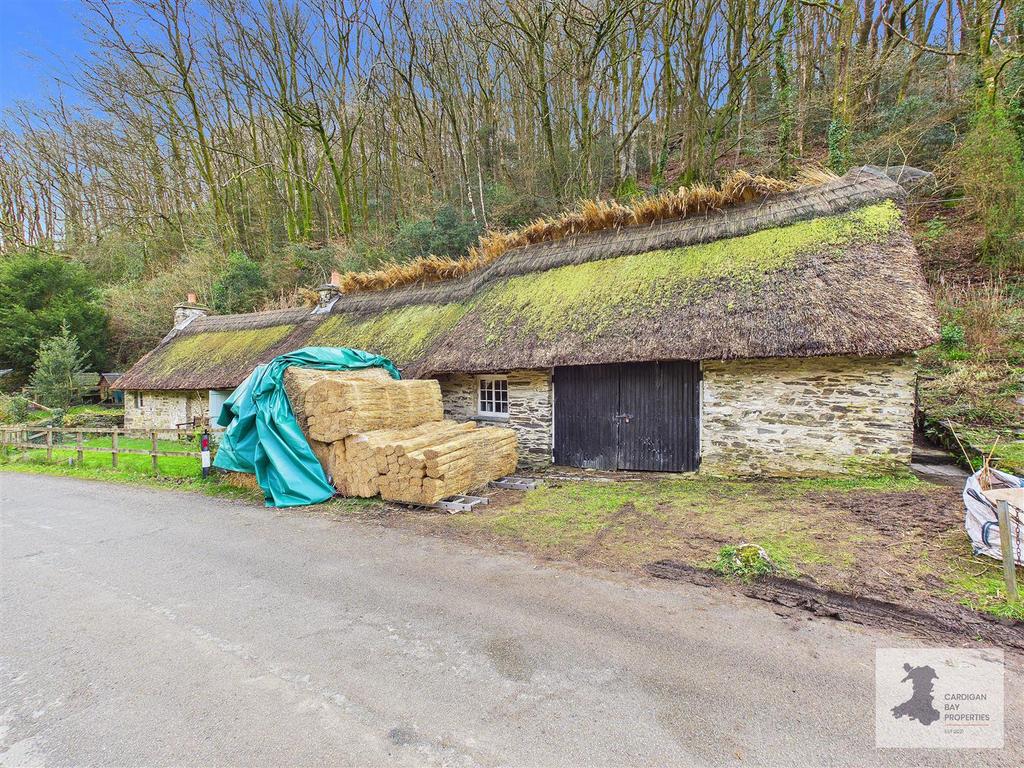 Thatched outbuildings