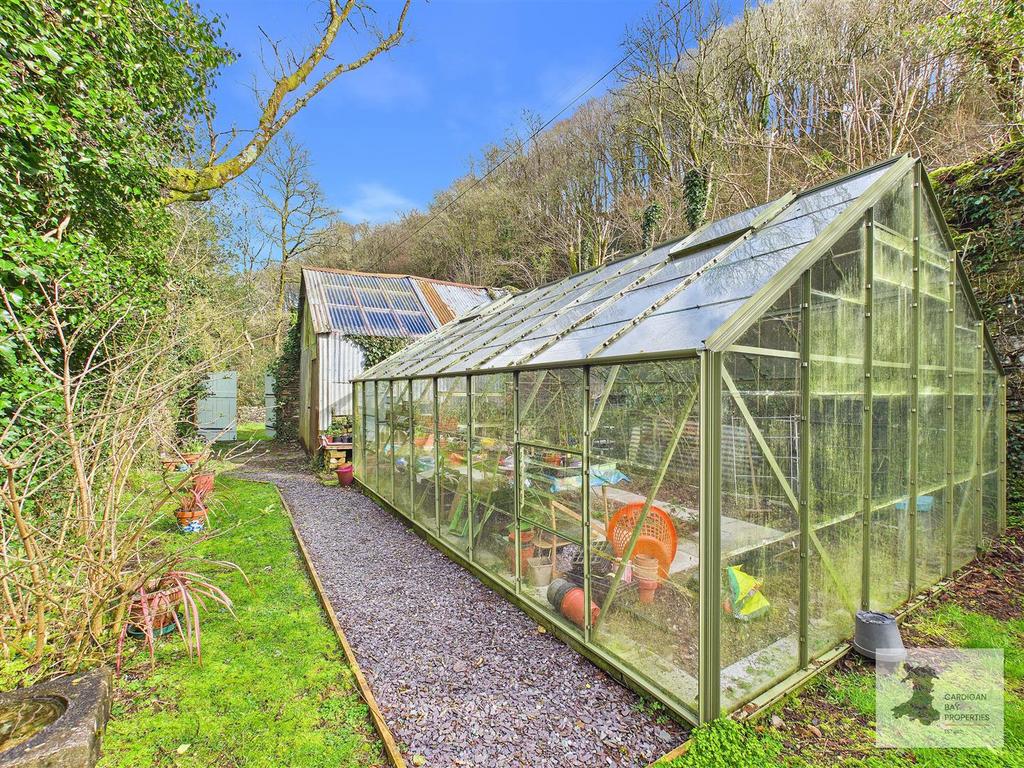 Greenhouse and outbuilding